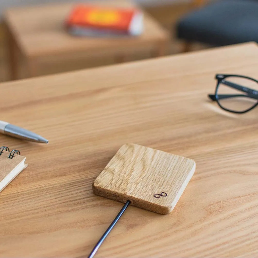 Wooden wireless charger on a wooden table